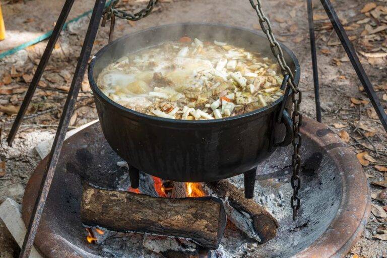 Pot Of Stew Cooking On An Open Fire